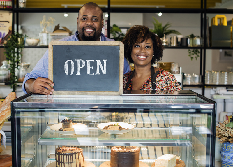 happy bakery owners who used local business listings